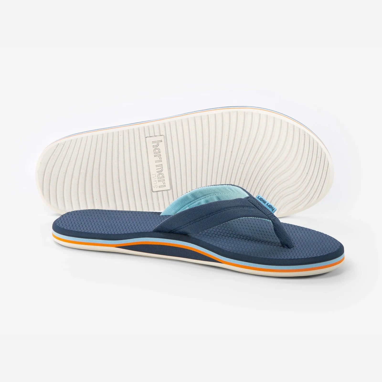 Navy blue flip flops with light blue and orange accents, ideal for beach days and coastal adventures