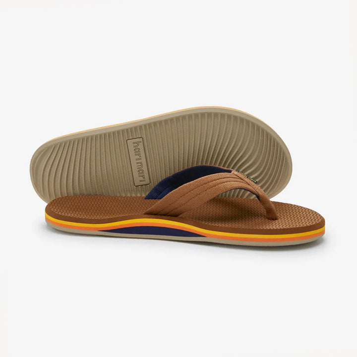 Brown flip flops with navy and orange stripes, ideal for beach days and coastal adventures.