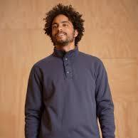 Man wearing navy blue quarter-zip pullover, coastal outdoor style for PNW adventures