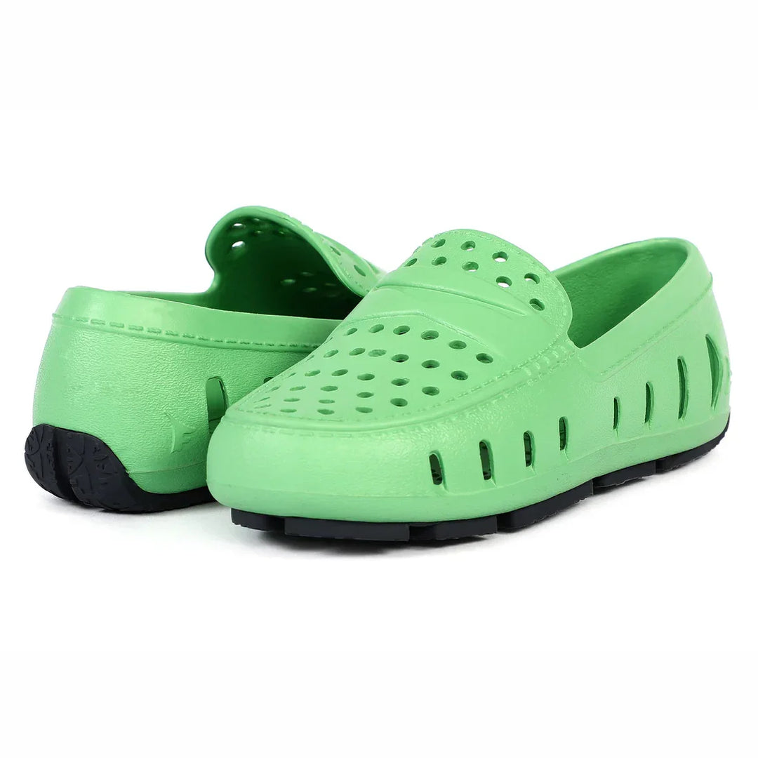 Green perforated water shoes with black soles, ideal for beach or pool use