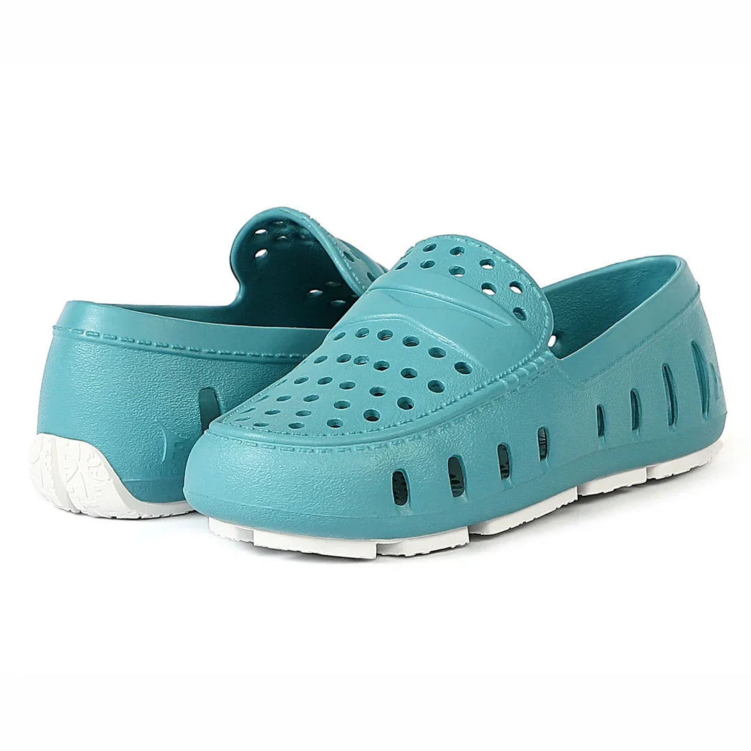 Teal perforated water shoes with white sole, ideal for beach or pool use