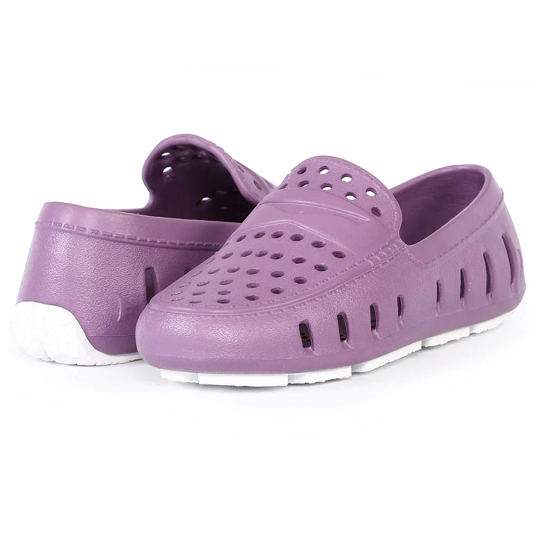 Purple perforated water shoes with white soles, ideal for beach or pool activities