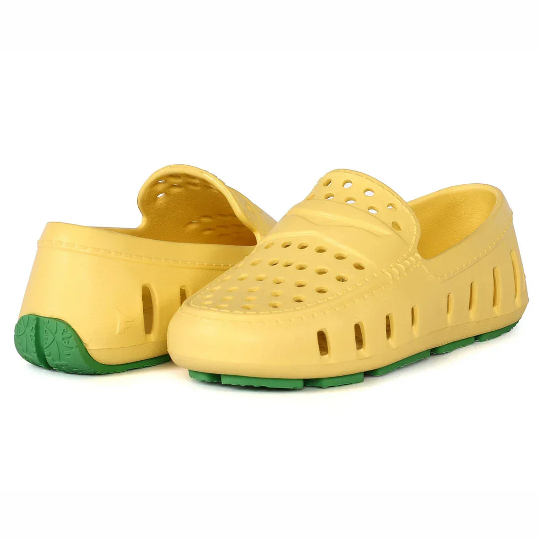 Yellow perforated water shoes with green soles, ideal for beach or pool use