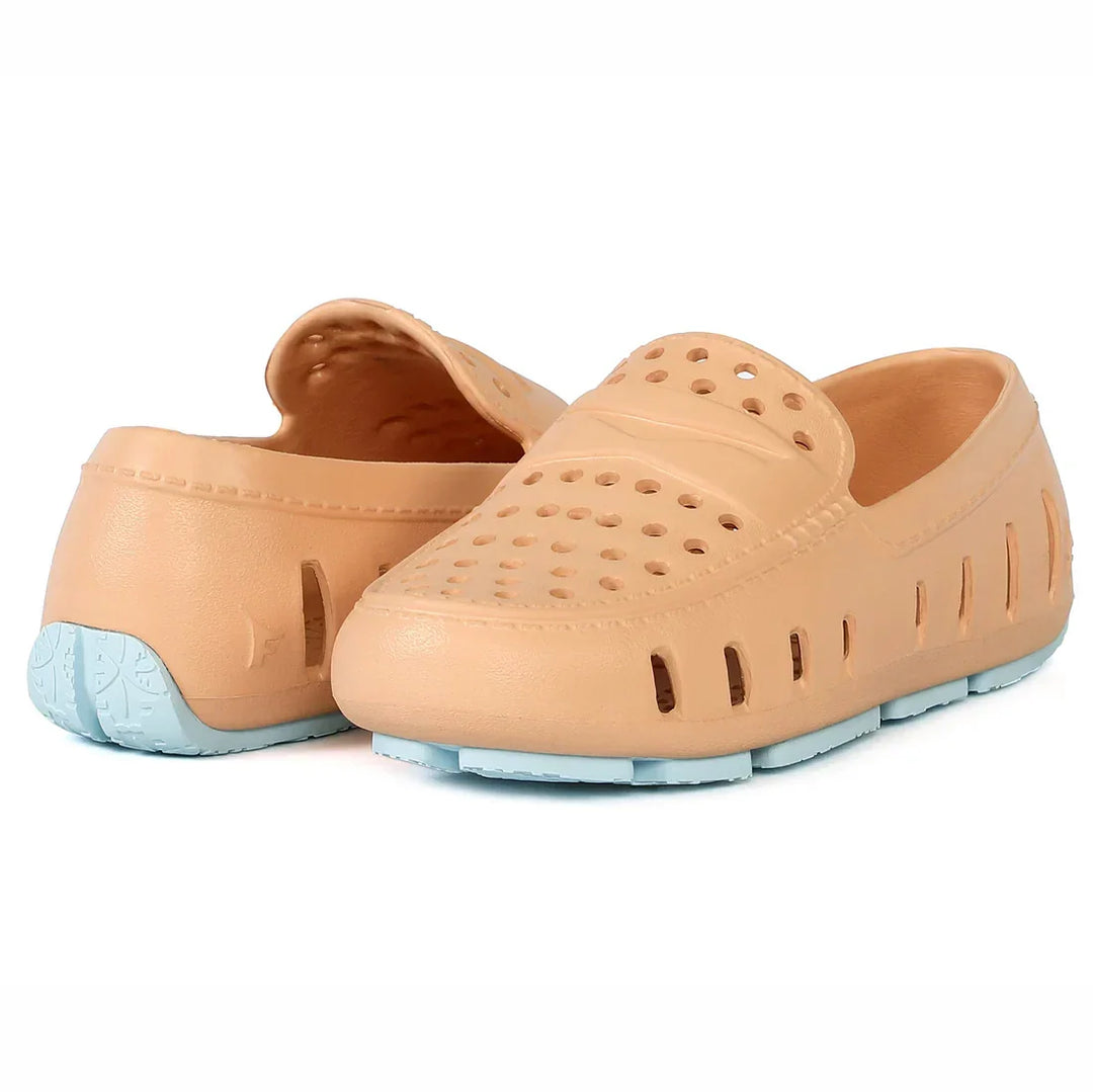 Beige perforated water shoes with light blue sole, ideal for beach or pool use