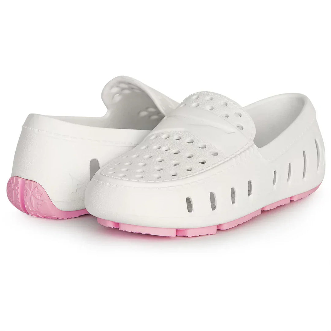 White kids' water shoes with pink soles, breathable perforated design for beach or pool use