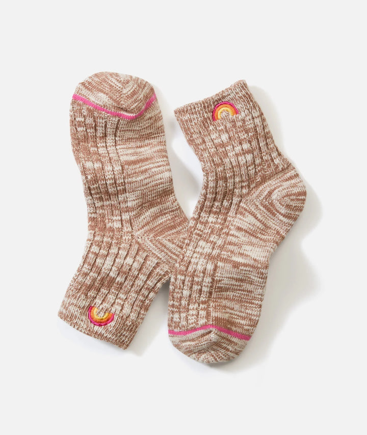 Cozy marled knit socks with rainbow embroidery, perfect for PNW adventures and everyday coastal style.