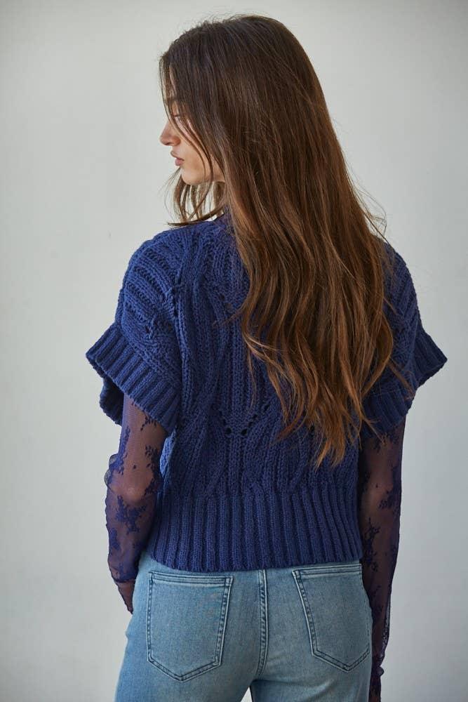 Navy blue knit sweater with lace sleeves, paired with denim jeans for coastal PNW style