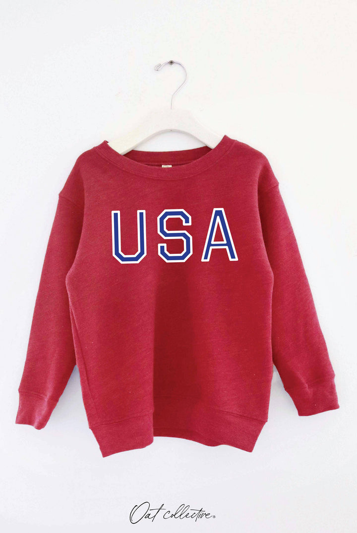 Red USA graphic sweatshirt for casual outdoor wear, perfect for PNW adventures and coastal style.