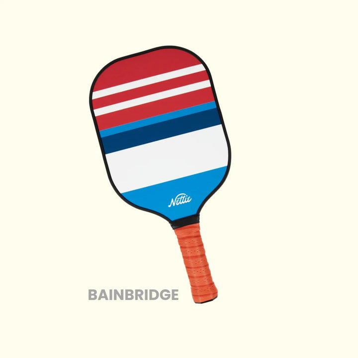 Red white blue striped pickleball paddle with orange grip, Bainbridge design