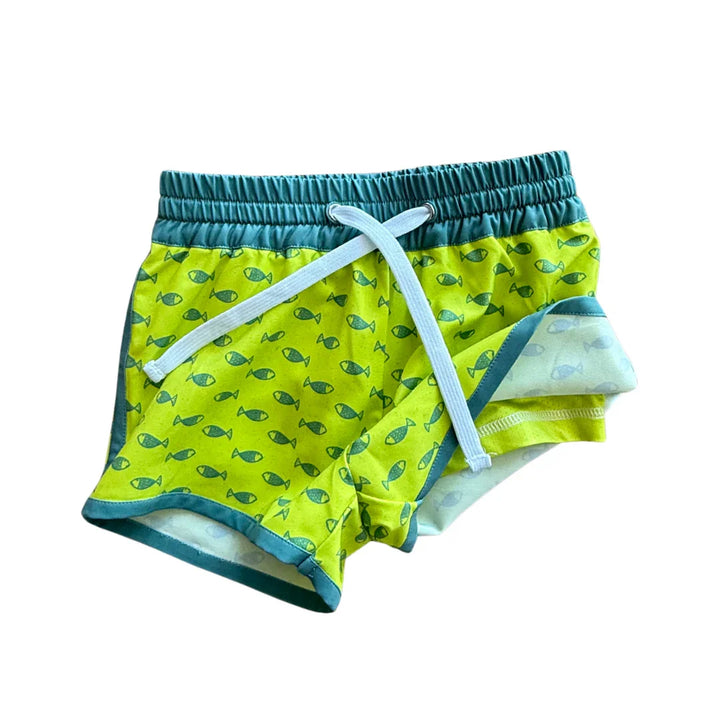 Bright green swim shorts with fish print, elastic waist, and drawstring for beach or pool adventures.