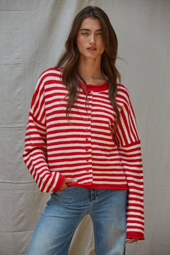 Red and white striped button-up cardigan sweater with cozy texture, styled with blue jeans for casual coastal wear