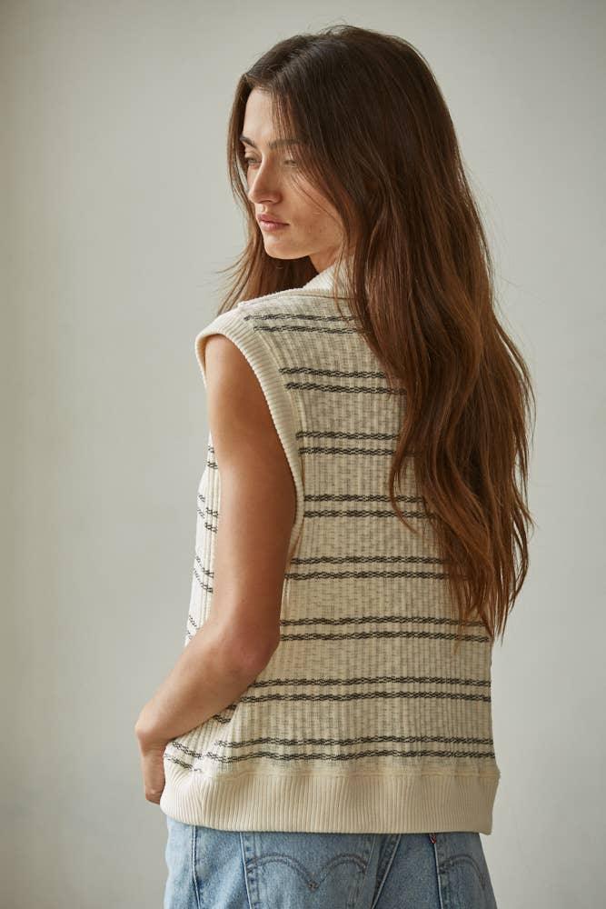 Cream striped knit vest with ribbed hem, styled for coastal PNW weekend adventures