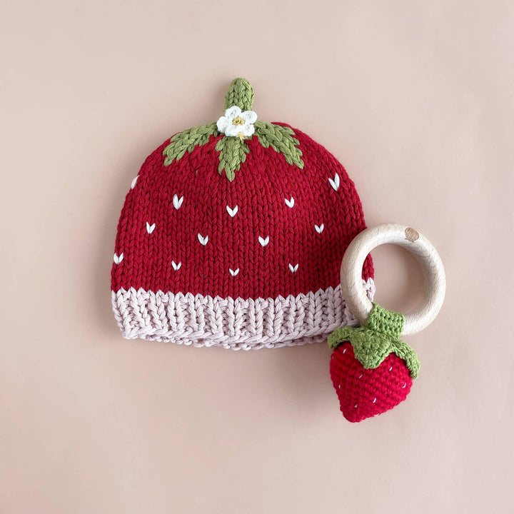 Knit strawberry baby hat with matching teether rattle, red and green with white accents