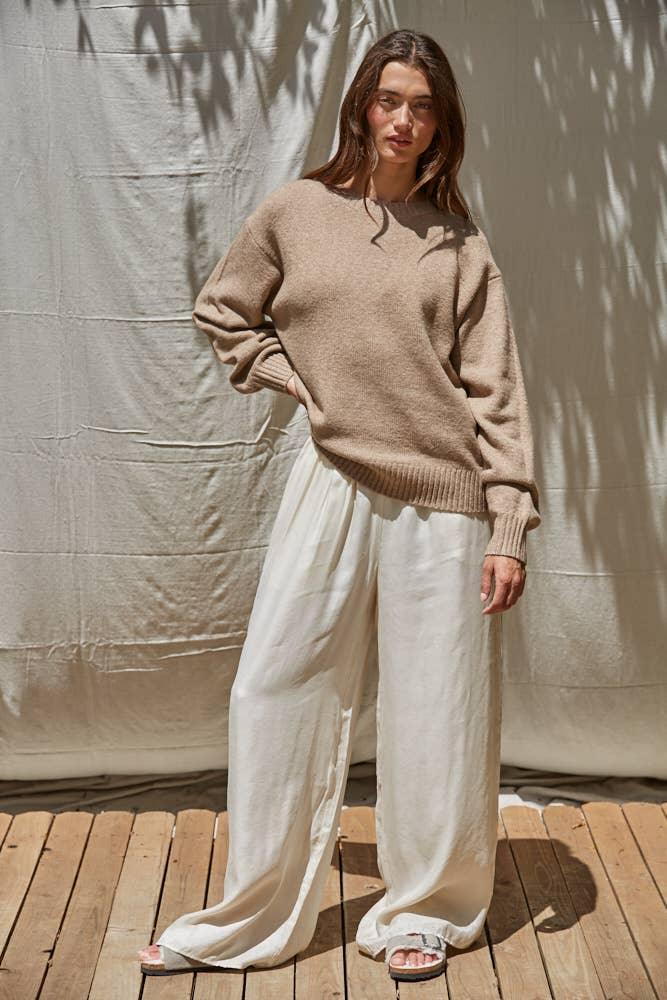 Cozy beige sweater with wide-leg white pants, perfect for coastal PNW style and outdoor weekends.