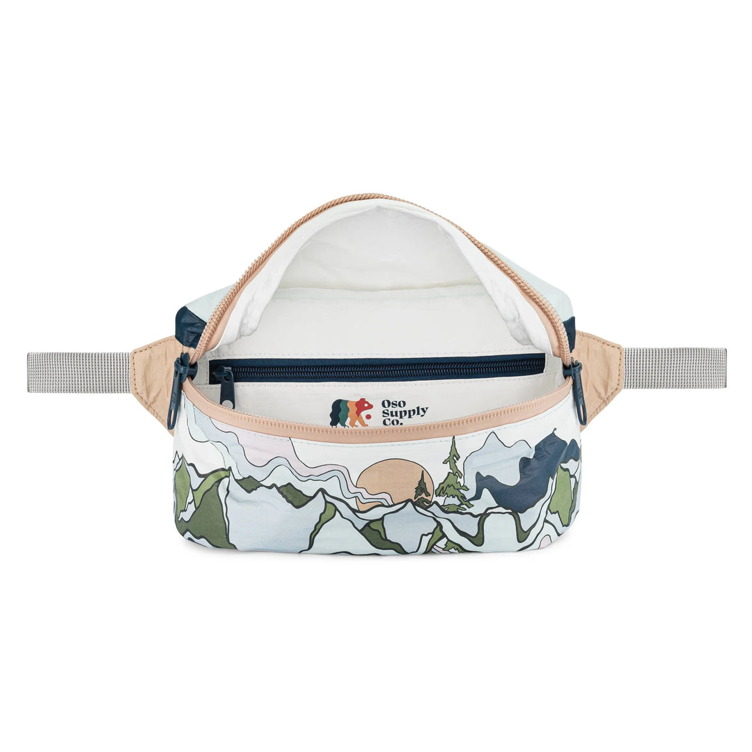 Mountain-themed fanny pack with scenic print and Oso Supply Co. branding, ideal for outdoor adventures.