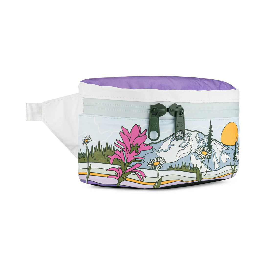Purple fanny pack with mountain, flowers, and sunset design, ideal for outdoor adventures.