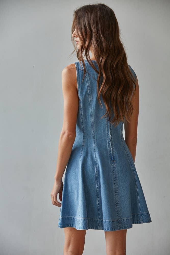 Woman wearing sleeveless denim dress, coastal style for beach days and casual weekends