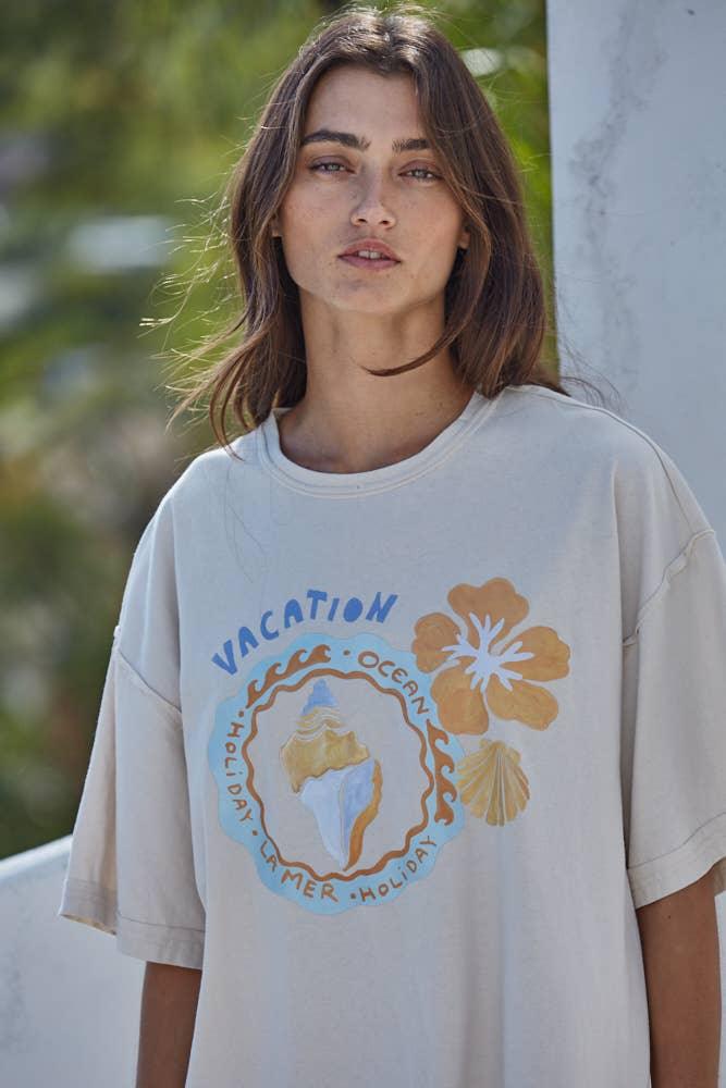 Coastal vacation graphic tee with seashell and hibiscus print, perfect for beach days and PNW adventures