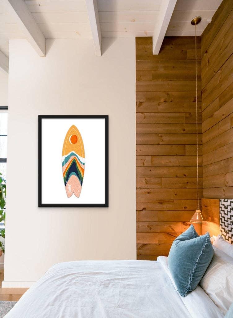 Moonrise Mountains Surfboard Puzzle by Jigsaw Surf Co. framed on a white bedroom wall.