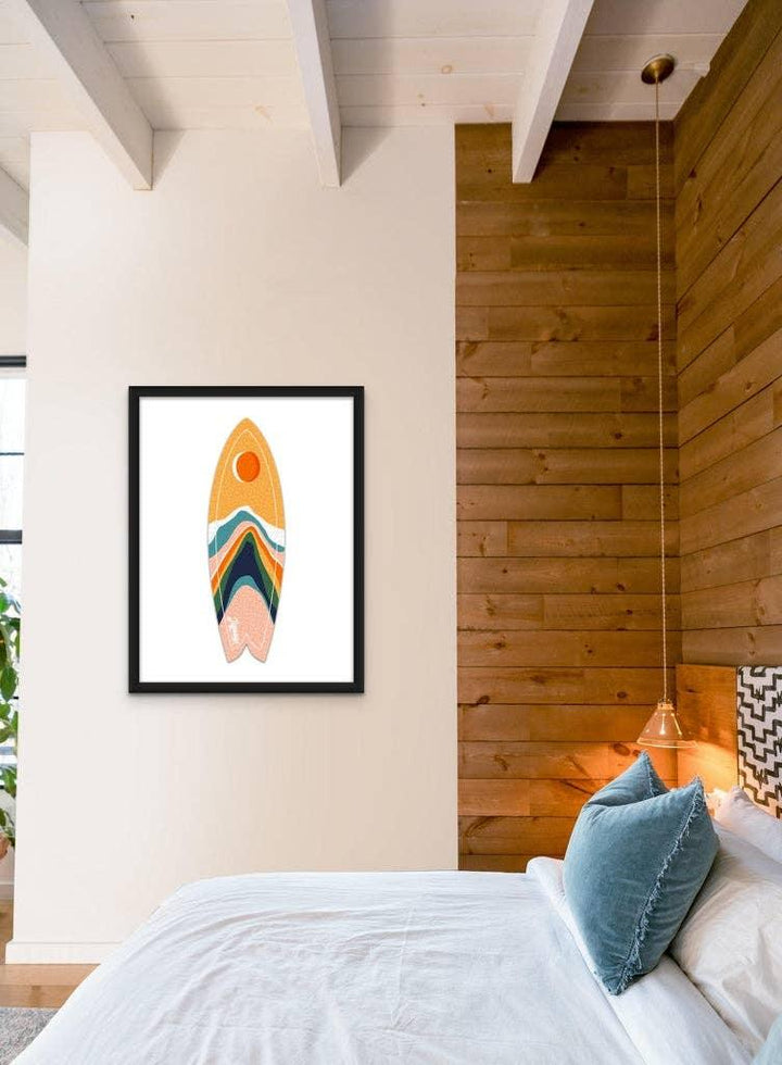 Moonrise Mountains Surfboard Puzzle by Jigsaw Surf Co. framed on a white bedroom wall.