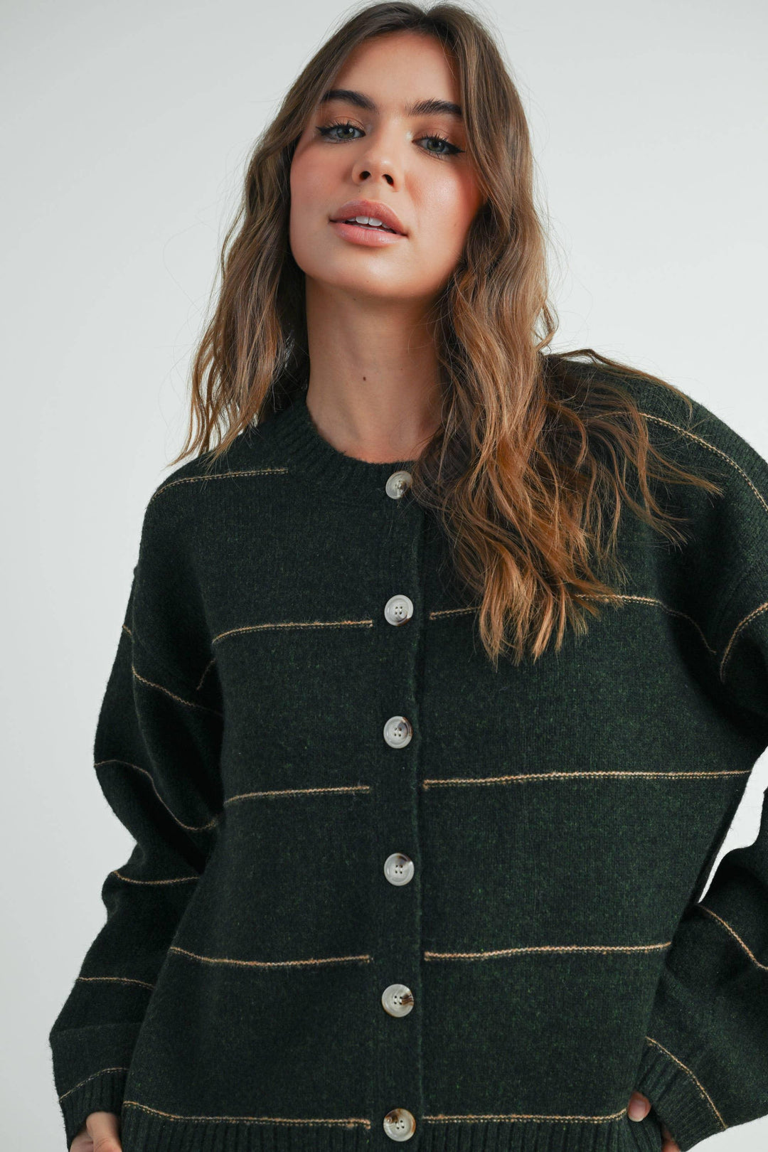 Forest green button-up cardigan with contrast stitching, cozy knit for PNW outdoor style