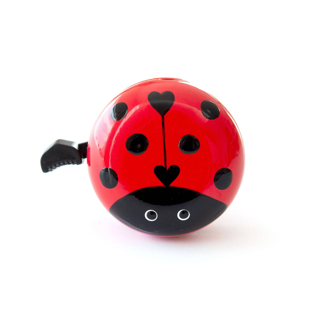 Red ladybug bike bell with black spots and heart details, perfect for kids&