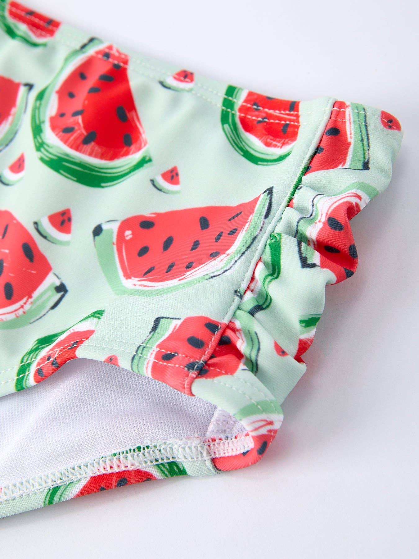 Watermelon print swim trunks with ruffled hem, perfect for beach days and summer adventures.