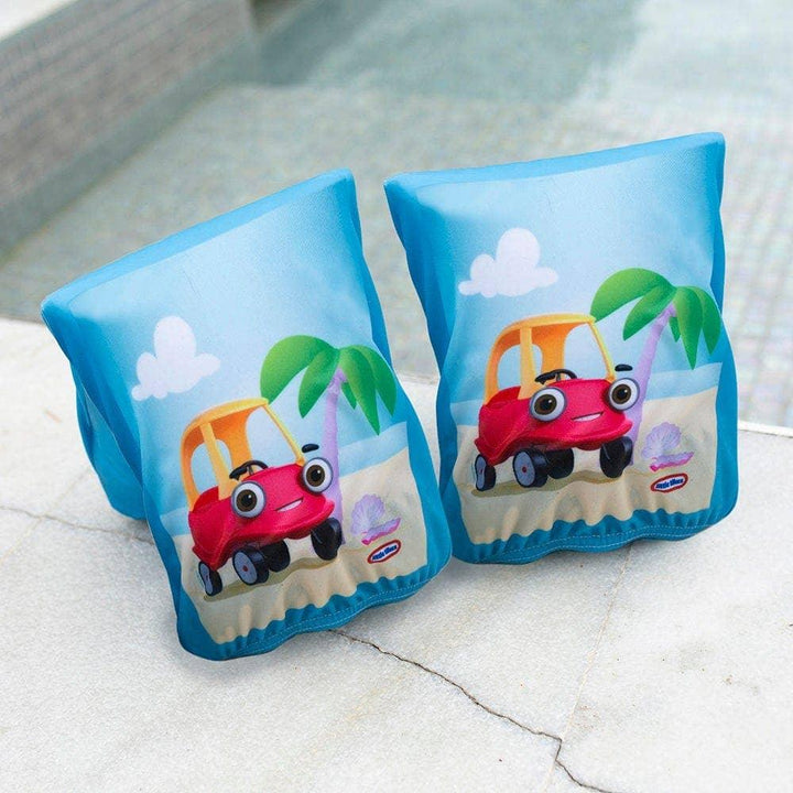 Blue swim floaties with red car design, palm trees, and beach scene for kids pool fun