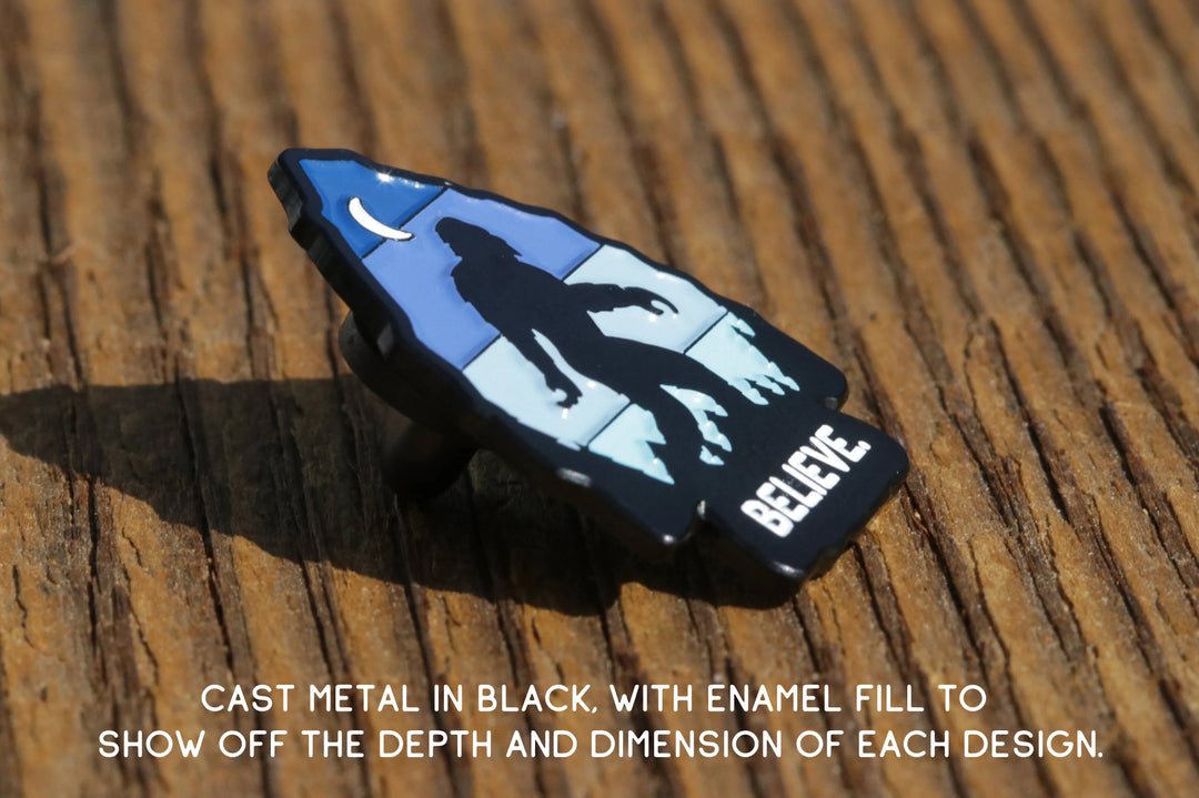 Cast metal pin with &