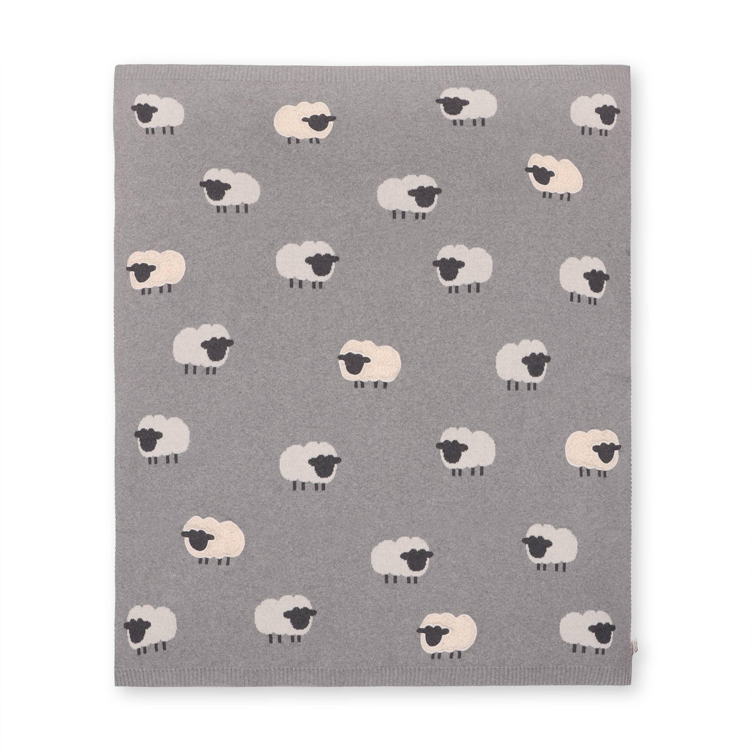 Gray baby blanket with cute white sheep pattern, soft knit texture for nursery or stroller