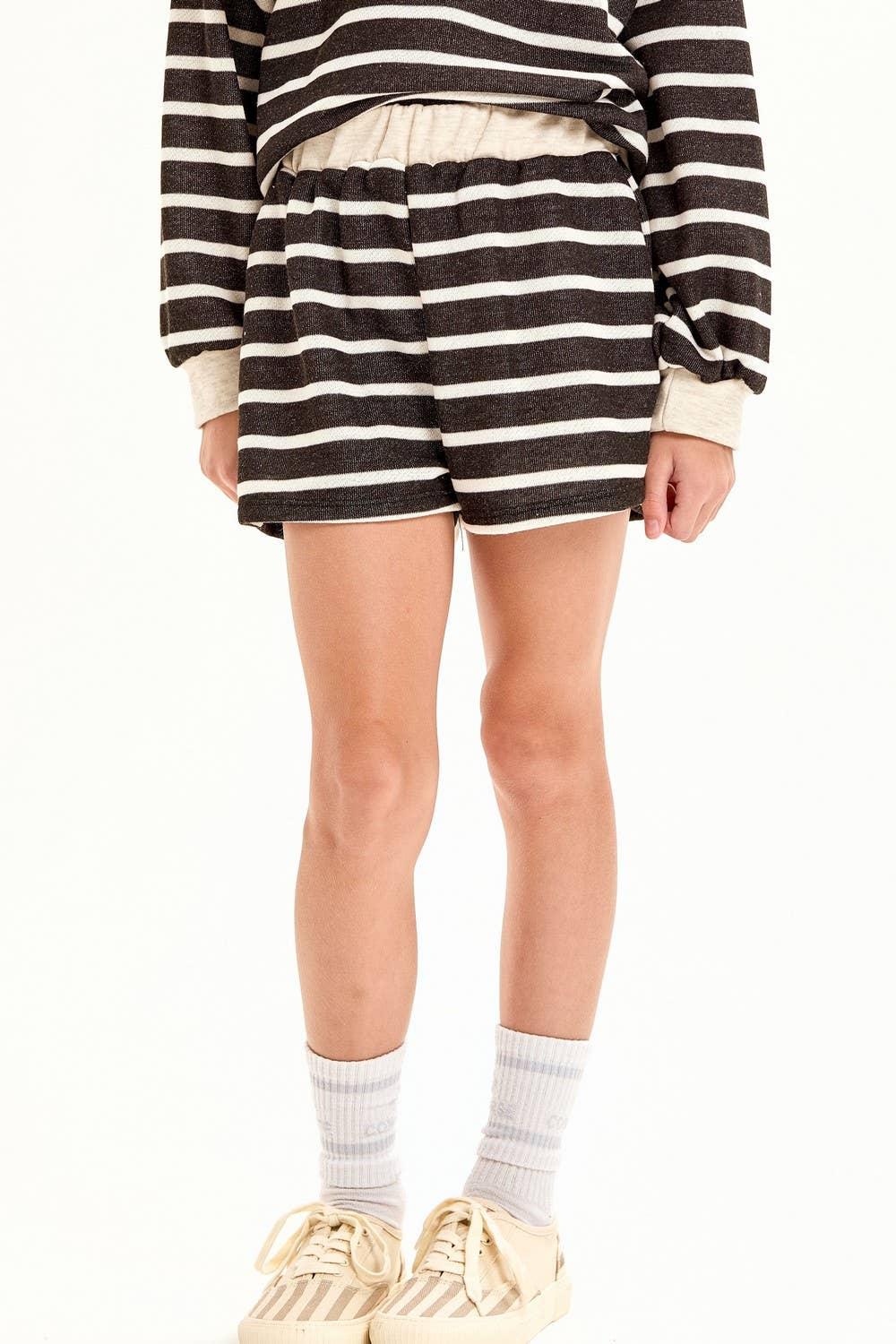 Striped lounge shorts with matching top, cozy socks, and casual sneakers for PNW coastal style