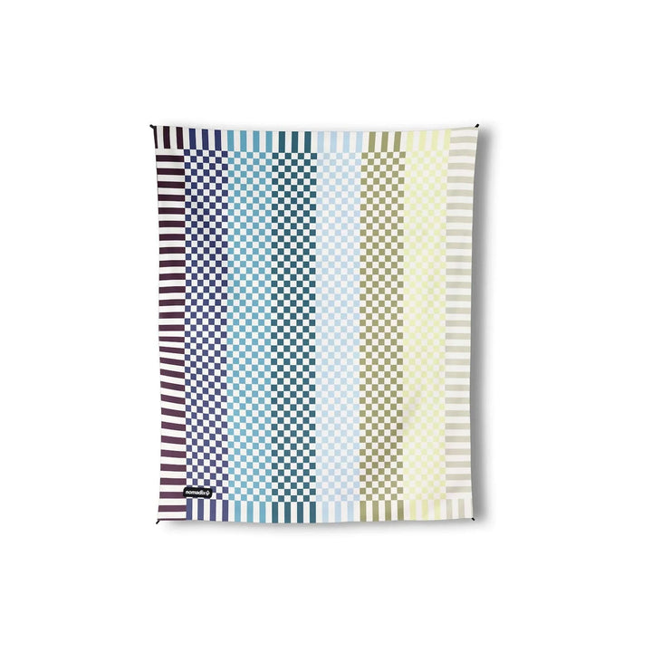 Colorful geometric patterned outdoor blanket with striped borders, perfect for beach days and PNW adventures