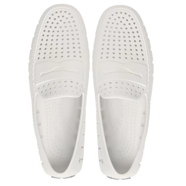 White perforated slip-on shoes for beach days and coastal adventures