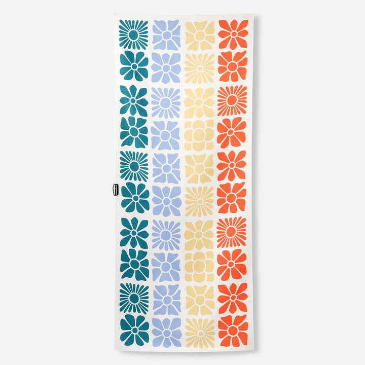 Colorful floral pattern beach towel with retro daisy design in blue, yellow, and orange stripes