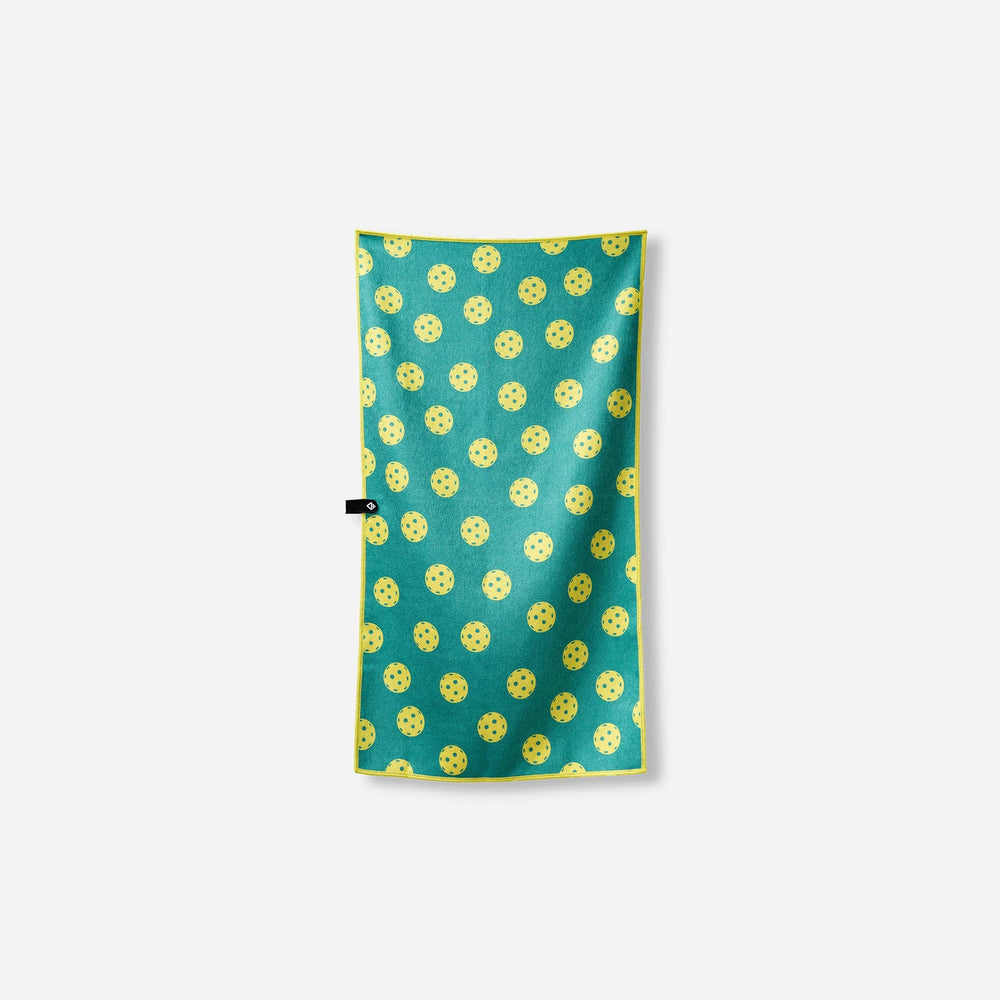 Teal beach towel with yellow pickleball pattern, perfect for outdoor adventures and coastal days.