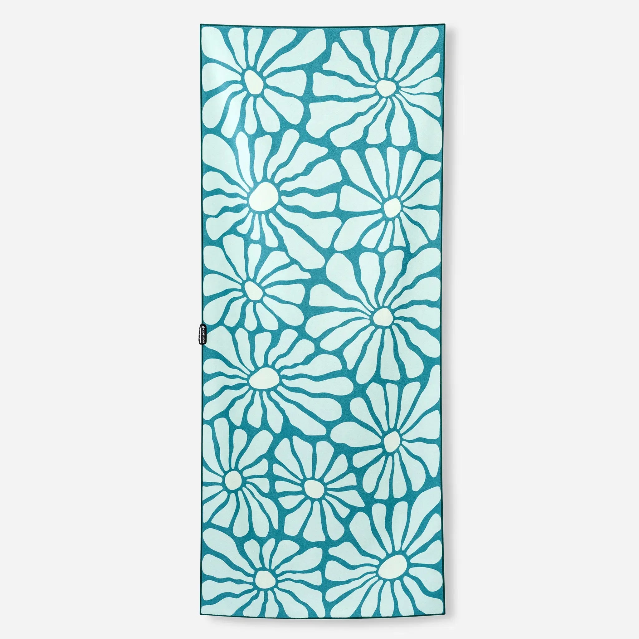 Teal yoga mat with white floral pattern, ideal for home workouts and outdoor adventures