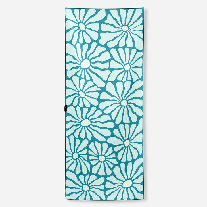 Teal yoga mat with white floral pattern, ideal for home workouts and outdoor adventures