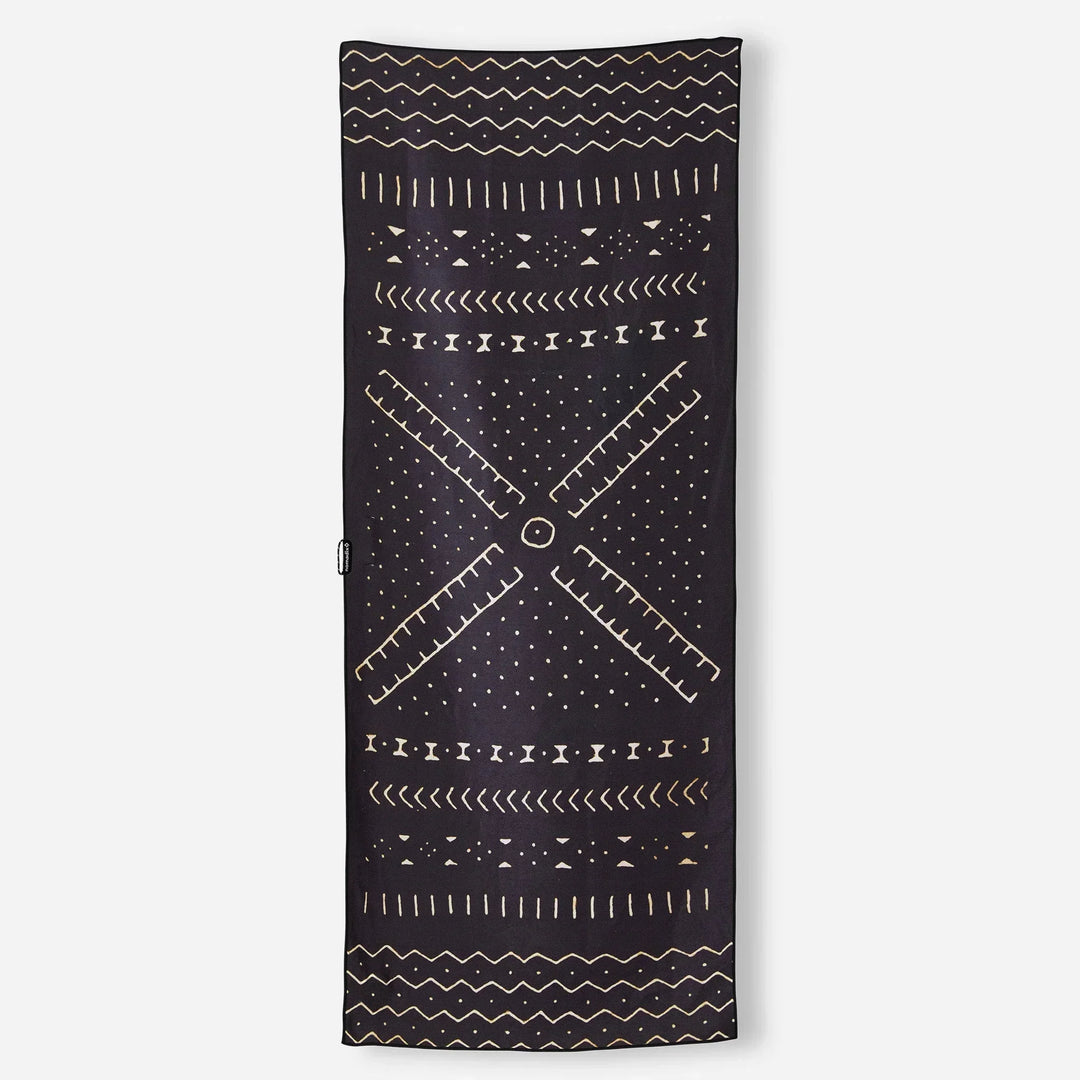 Black beach towel with gold geometric patterns and windmill design, perfect for coastal adventures and outdoor lifestyle.