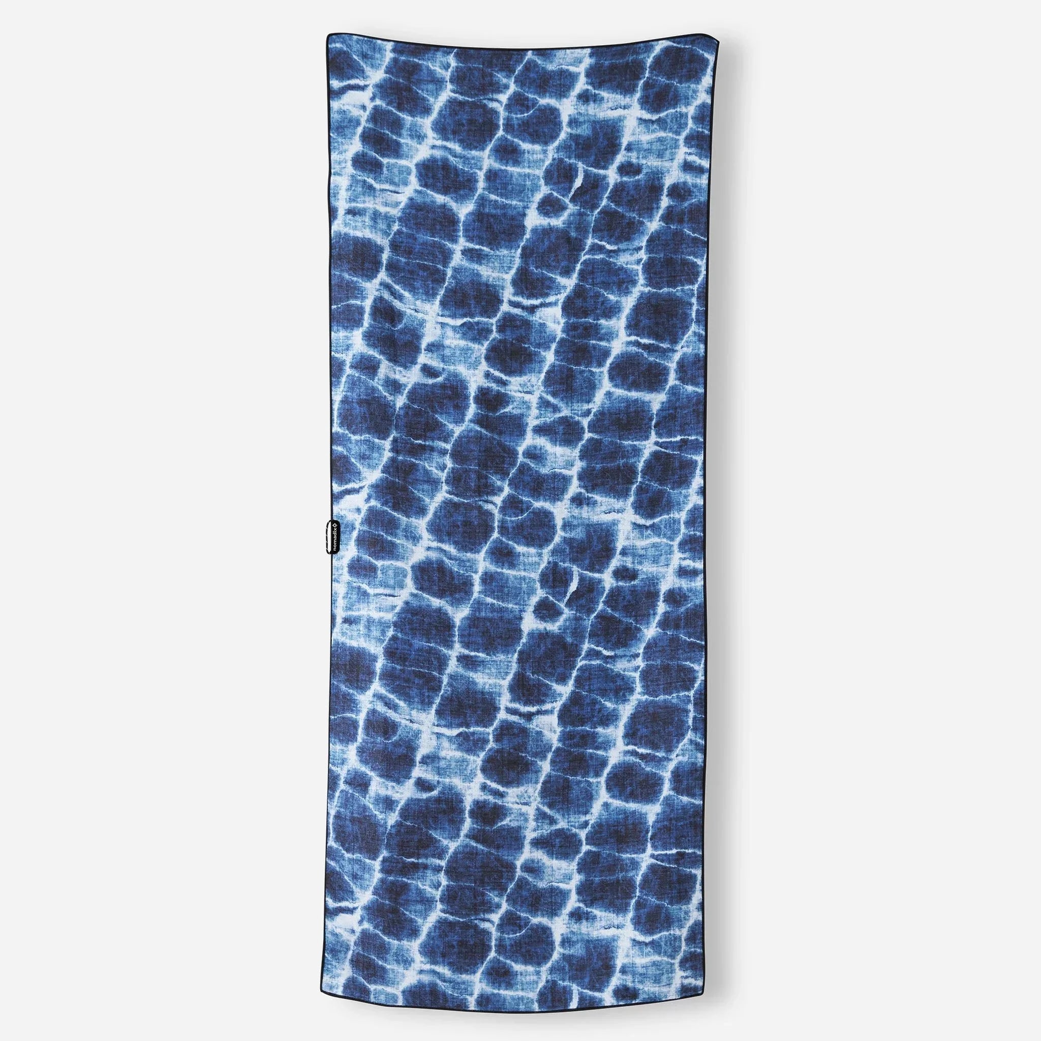 Blue tie-dye patterned travel towel with black border, ideal for camping and outdoor adventures.