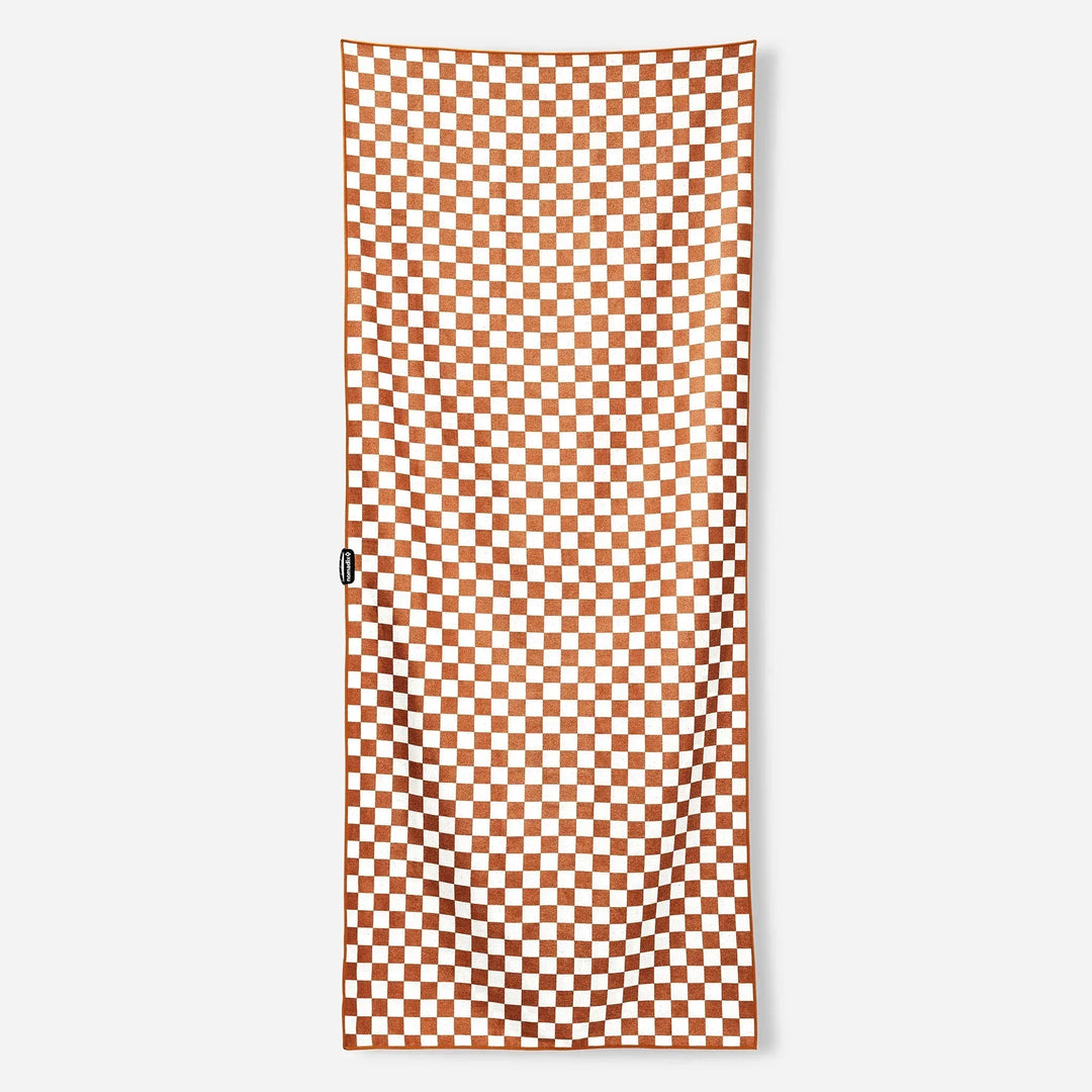 Orange and white checkered beach towel, perfect for outdoor adventures and picnics.