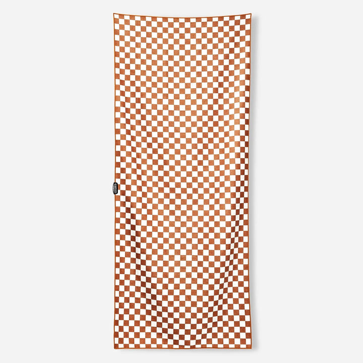 Orange and white checkered beach towel, perfect for outdoor adventures and picnics.