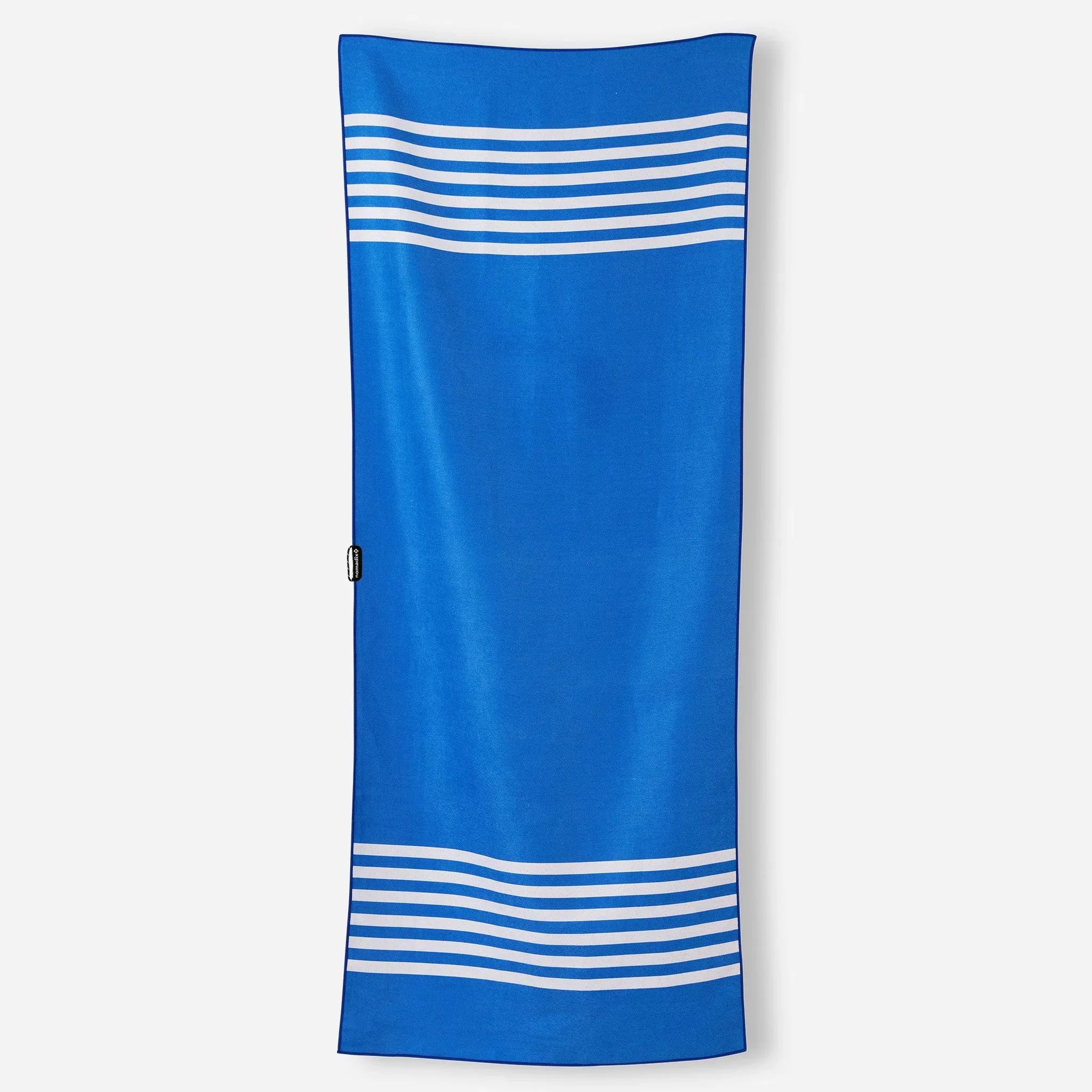 Blue beach towel with white stripes, ideal for poolside or outdoor adventures