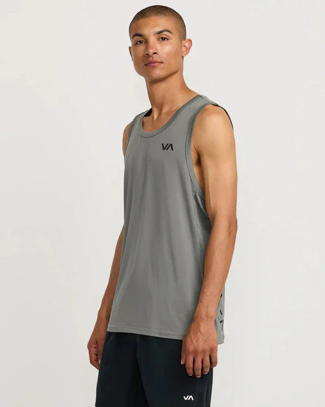 Man wearing gray VA tank top and black shorts, ideal for outdoor adventures and coastal style