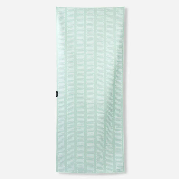 Mint green beach towel with white geometric pattern, perfect for coastal adventures and outdoor lifestyle gear.